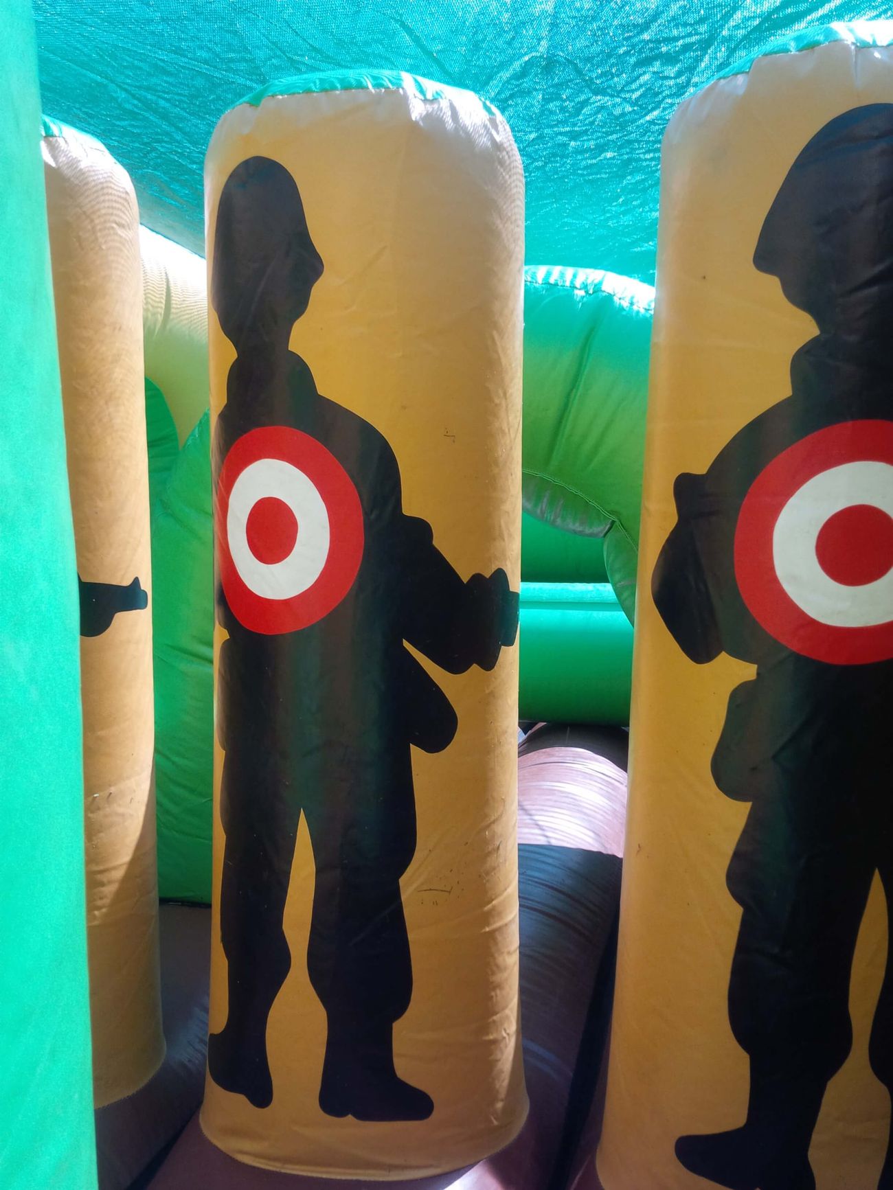 Interior biff-and-bash soldier target pillars inside the camouflage assault course