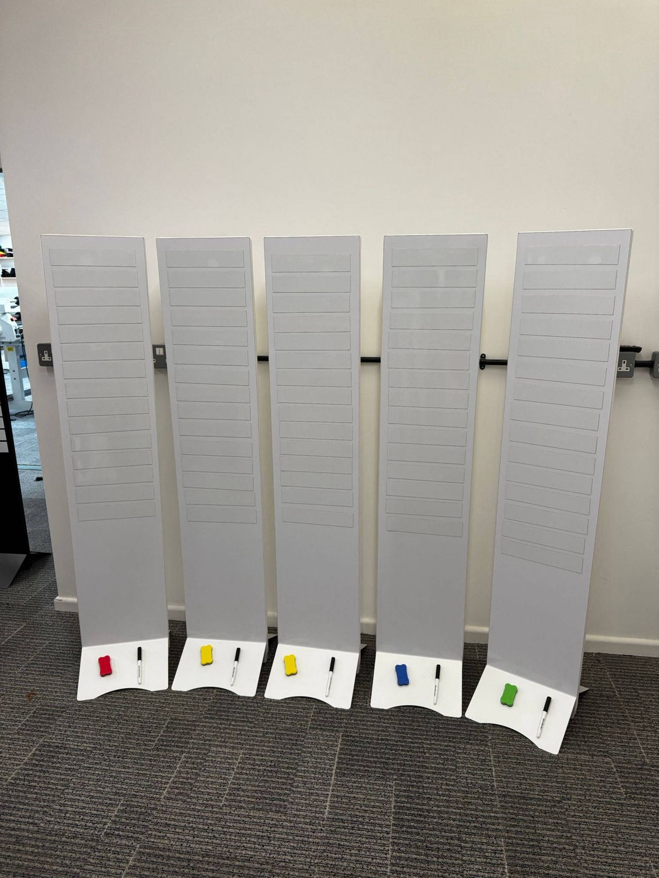 Five unbranded leaderboard boards in a row, each with write-on strips, marker and eraser