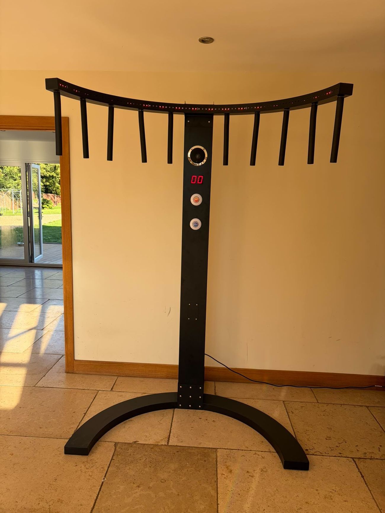 Black Catch It Drop It reaction game with hanging rods and red digital score display