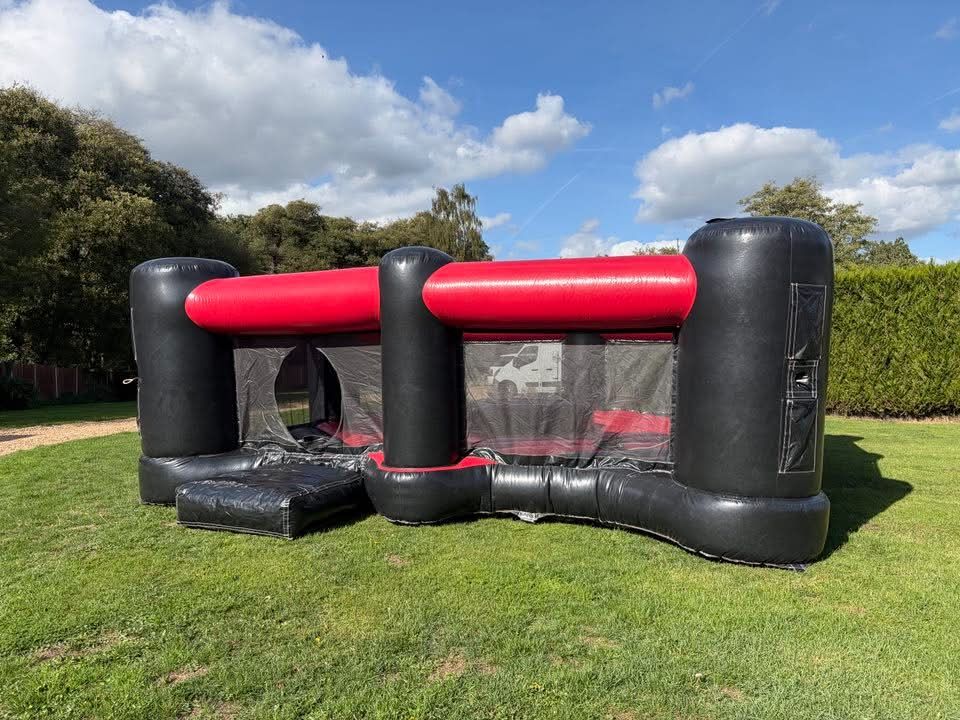 Front view of the 4 player Dash N Grab arena with entrance mat laid out on the lawn