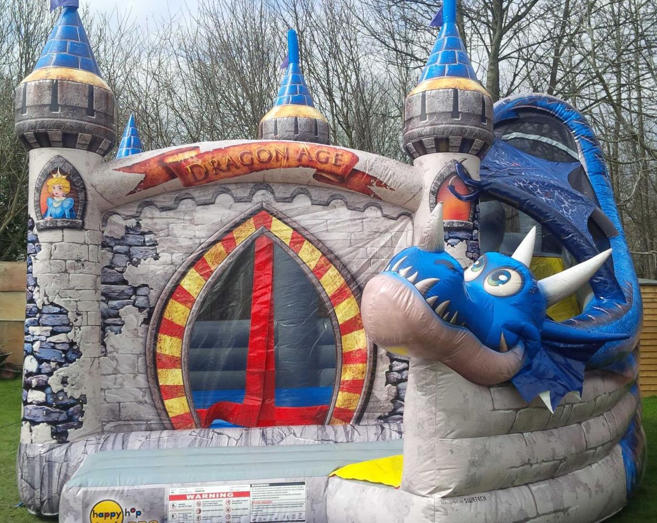 Close-up of the Dragon Age castle front, blue dragon head and red and yellow archway