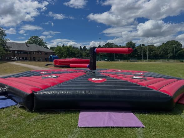 Outdoor inflatable activity set up at LVS Ascot for a school leavers BBQ