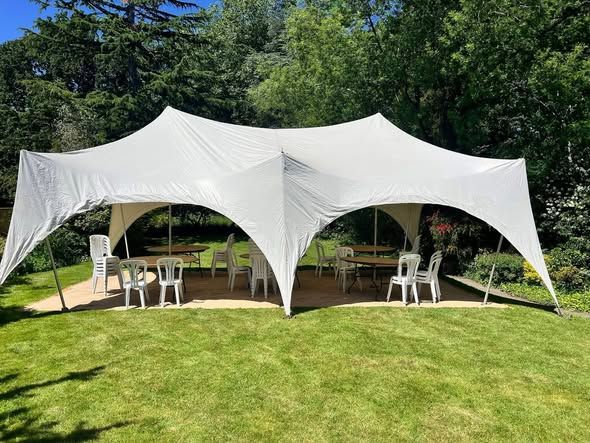 White Capri marquee set up on grass for a private party