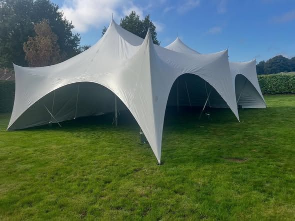 White marquee set up on grass in Petersfield