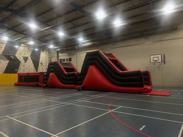 Indoor inflatable activity setup for a Portsmouth school event