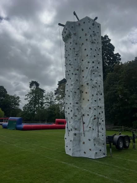 Climbing wall and inflatable activities at a Surrey prep school