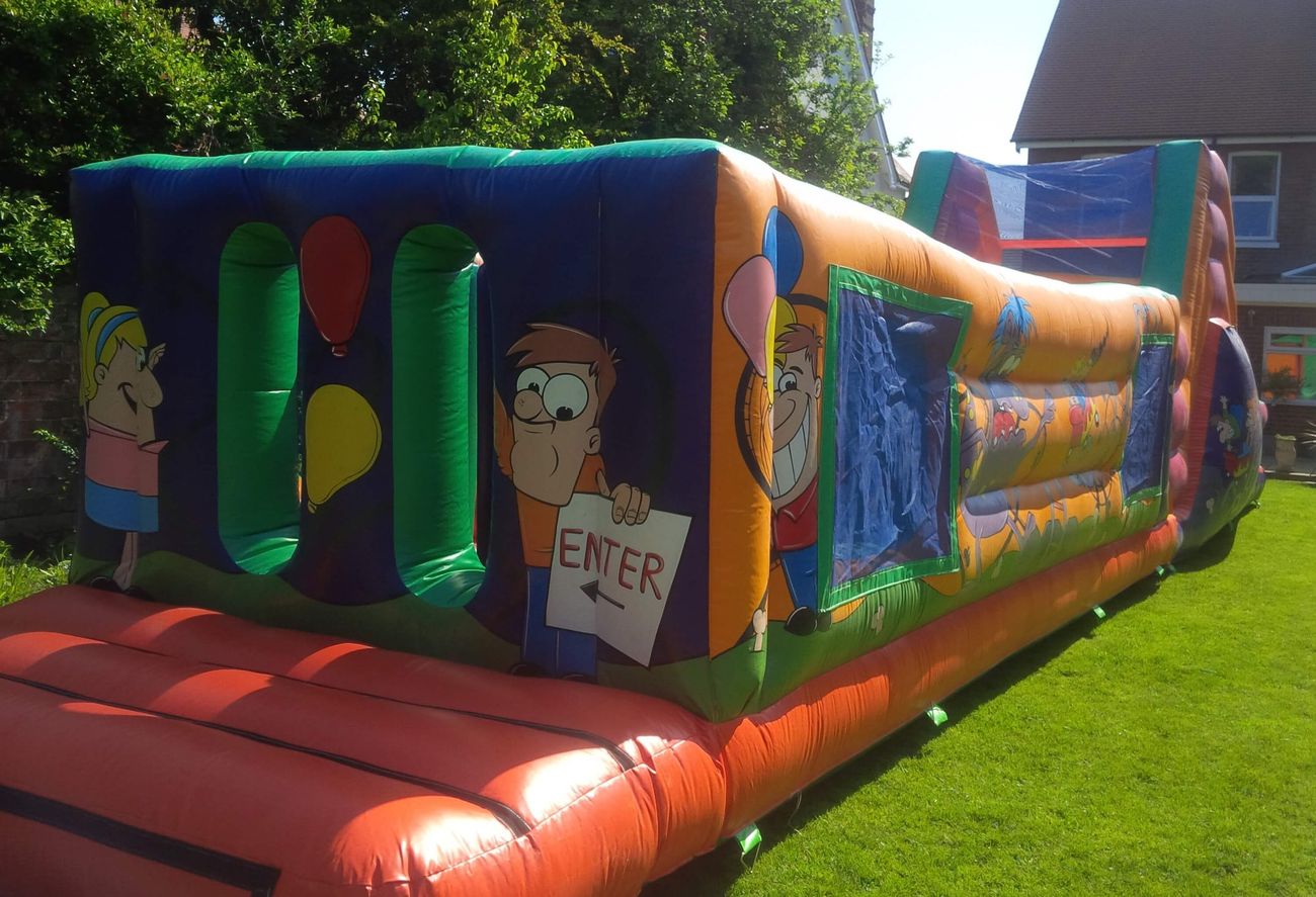 Front entry end with dark blue panel, cartoon girl with balloons, boy holding ENTER sign, red bed