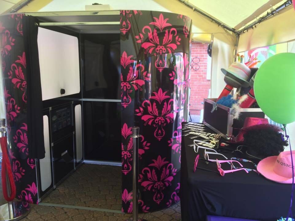 Black and pink damask Green Screen Dream Machine booth in a marquee with a prop table