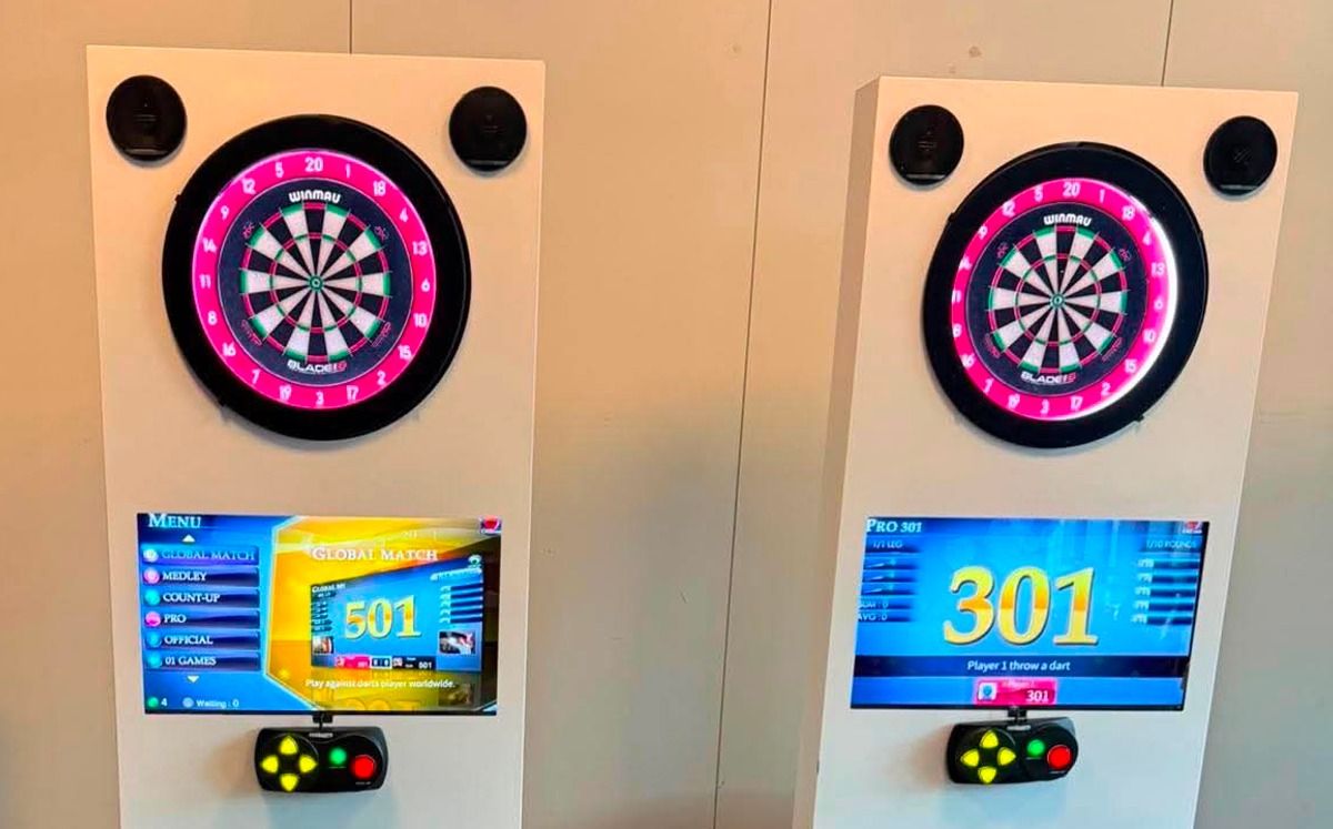 Two auto-scoring dartboards with illuminated surrounds and score screens