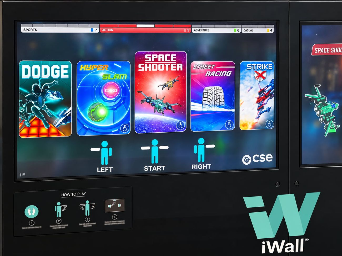 The iWall's action games menu at an exhibition, with Dodge, Hyper Slam and Space Shooter tiles