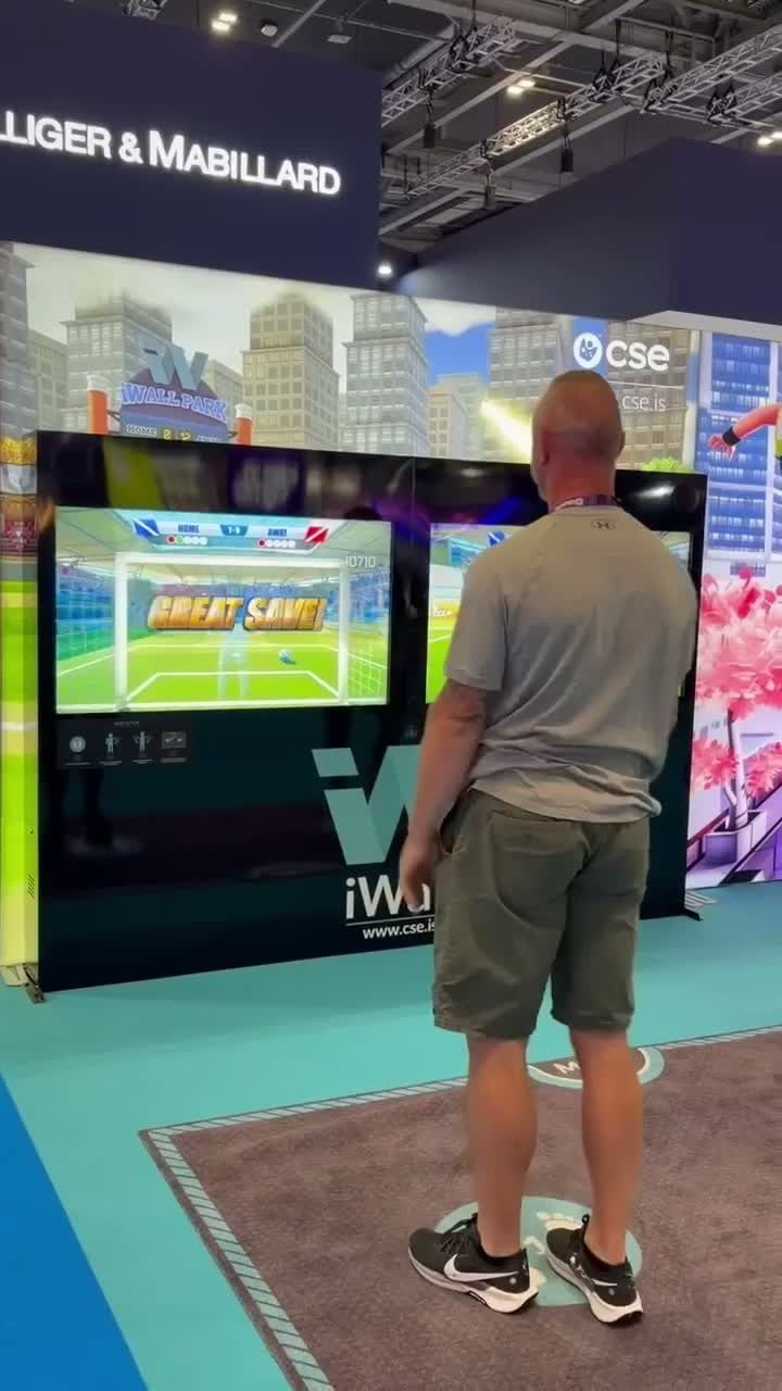 Making a save on the iWall football game, with GREAT SAVE on the screen