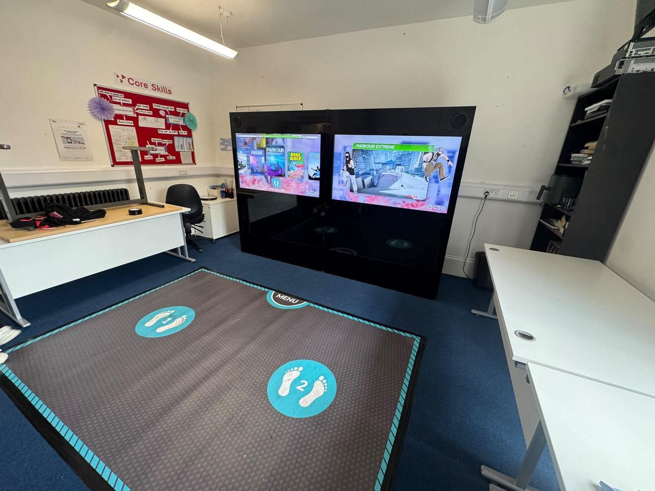 The iWall set up in a classroom, showing the Parkour Extreme and Disc Golf menus