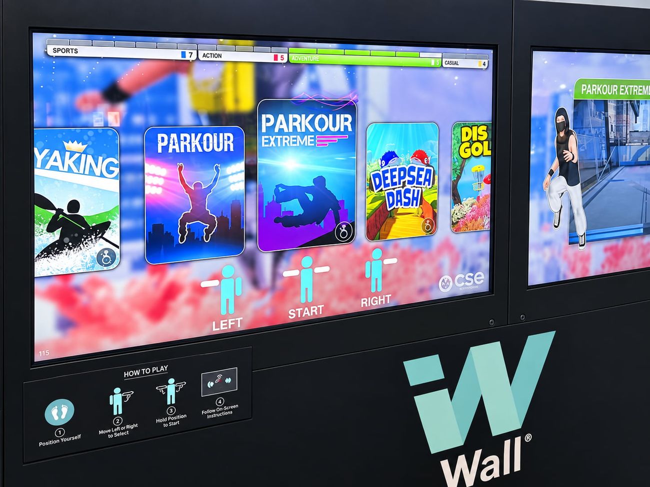 Parkour Extreme gameplay on the iWall's right-hand screen at an exhibition