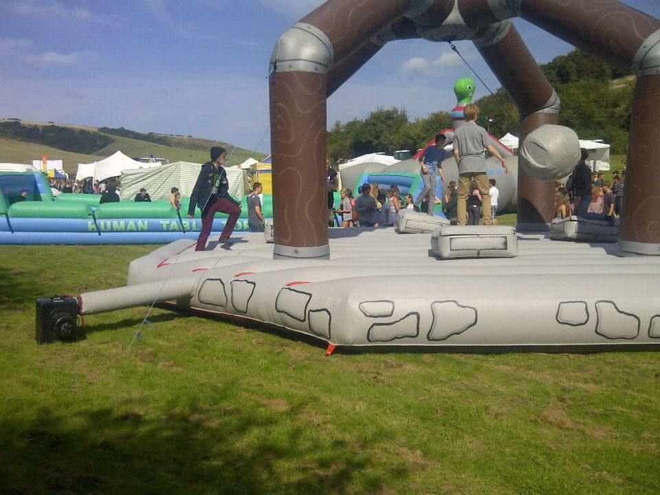Side view of the castle-stonework base and electric blower at an outdoor event