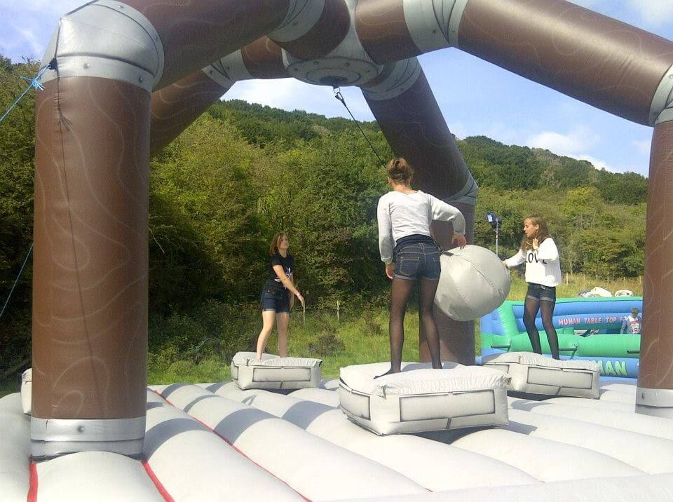 Players in everyday clothes taking on the wrecking ball game