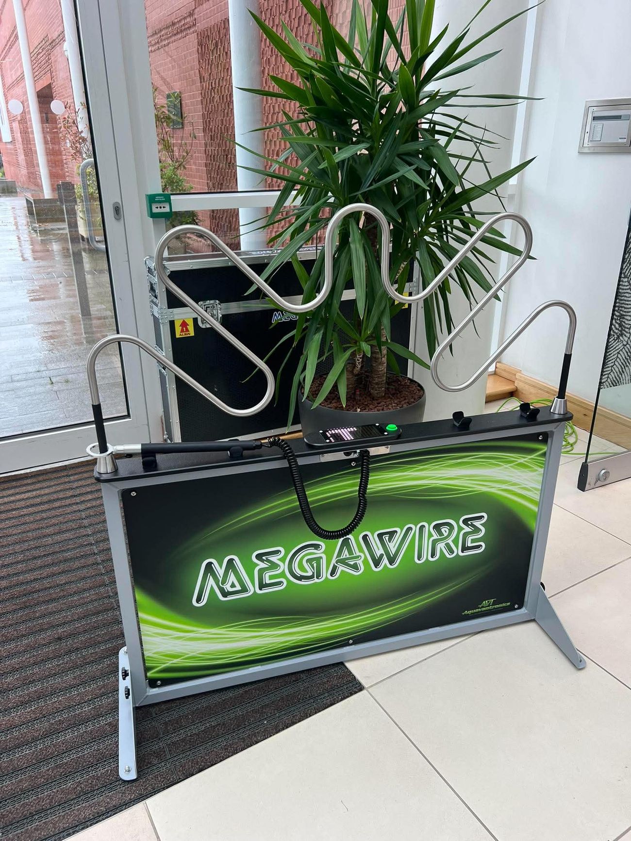 Green Mega Wire steady hand game showing the winding metal tube