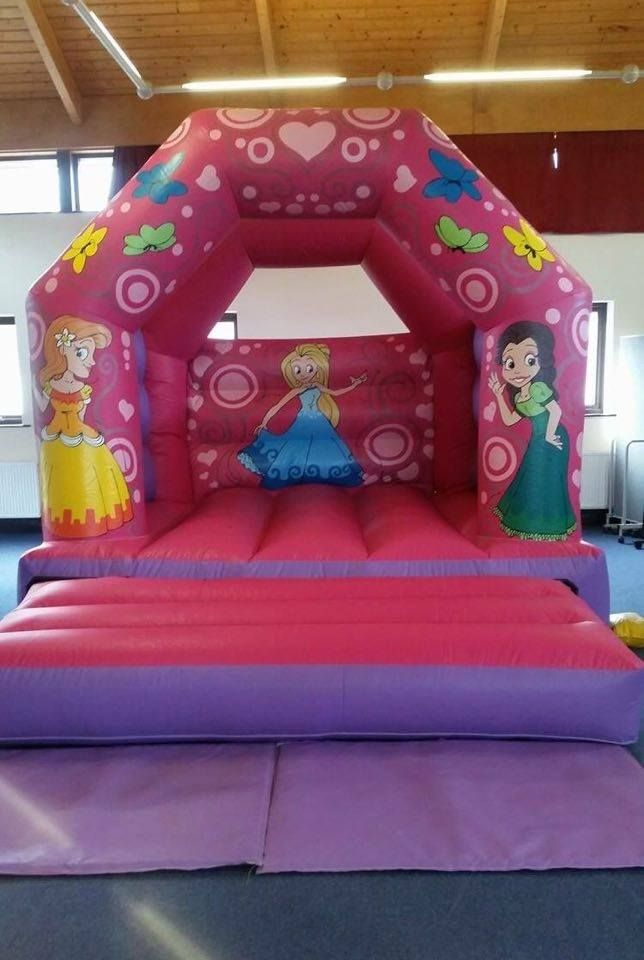 Pink and purple princess bouncy castle with fairytale princesses, hearts and butterflies
