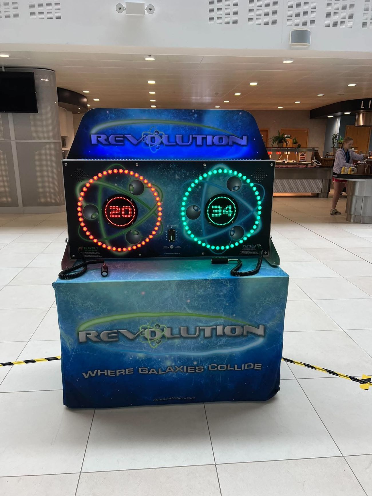 Revolution arcade reaction game showing two circular LED orbit rings