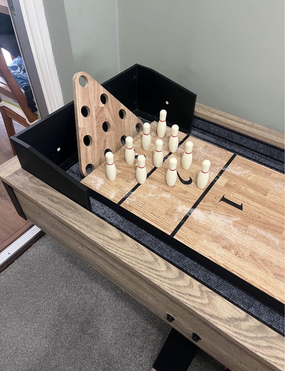 Close-up of the white skittles and triangular pin rack
