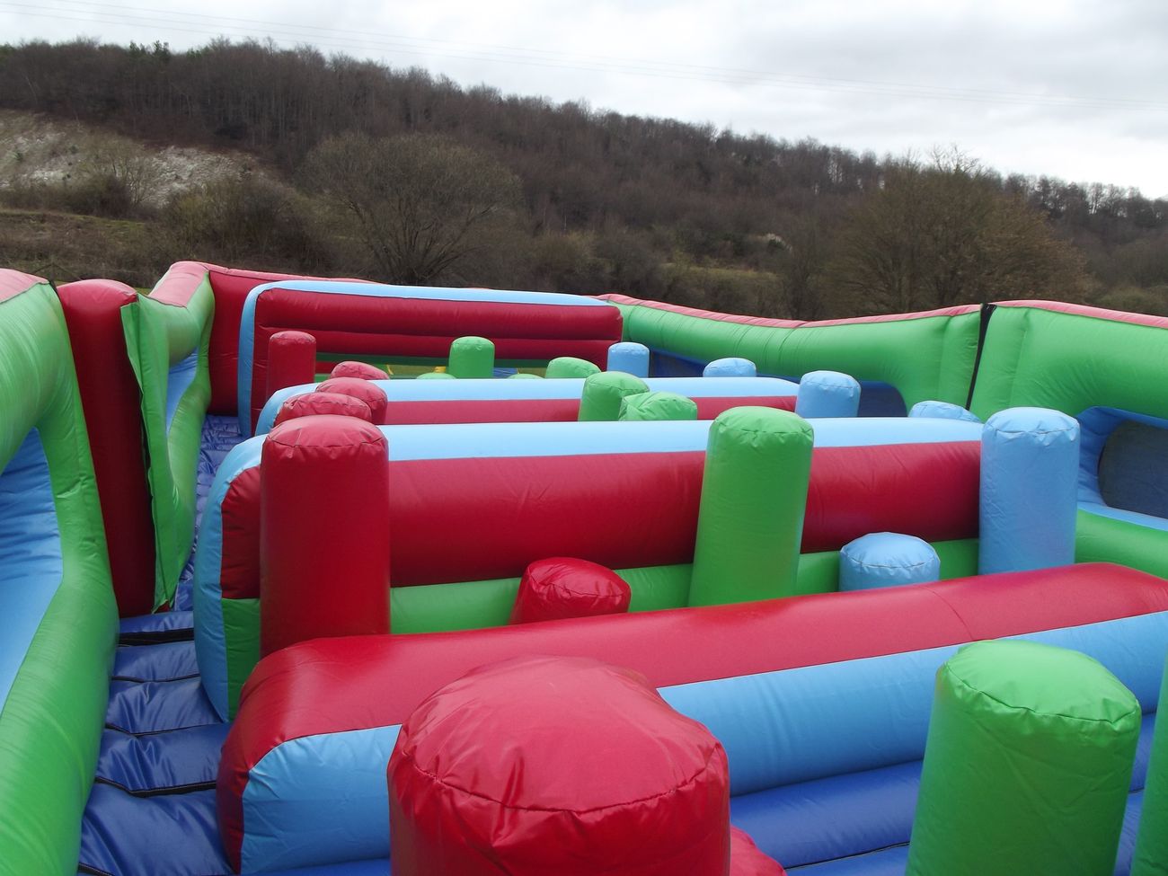 Empty interior of the Challenger showing rows of red, green and blue inflatable pillars and barriers