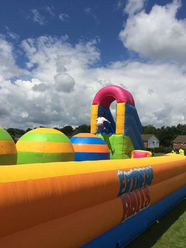 colourful big balls challenge inflatable in a field