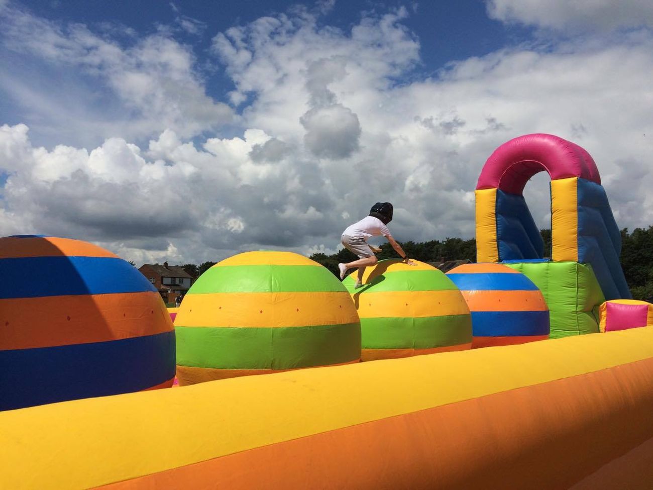 colourful big balls challenge inflatable in a field