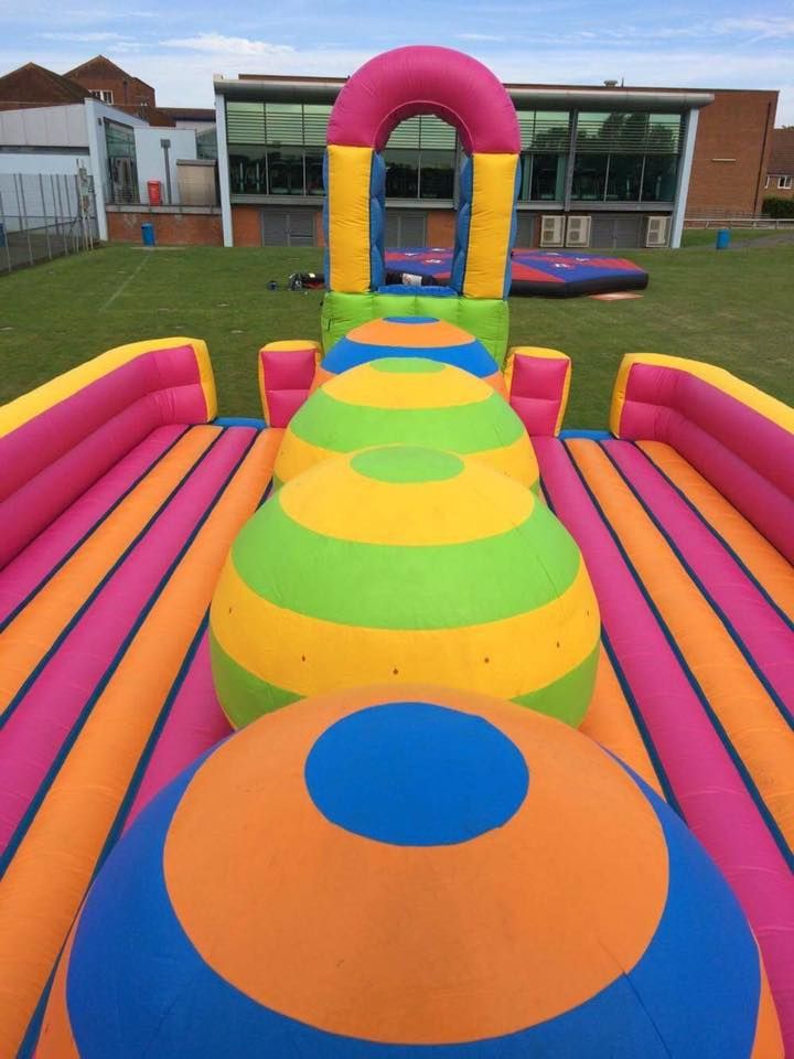 colourful big balls challenge inflatable in a field