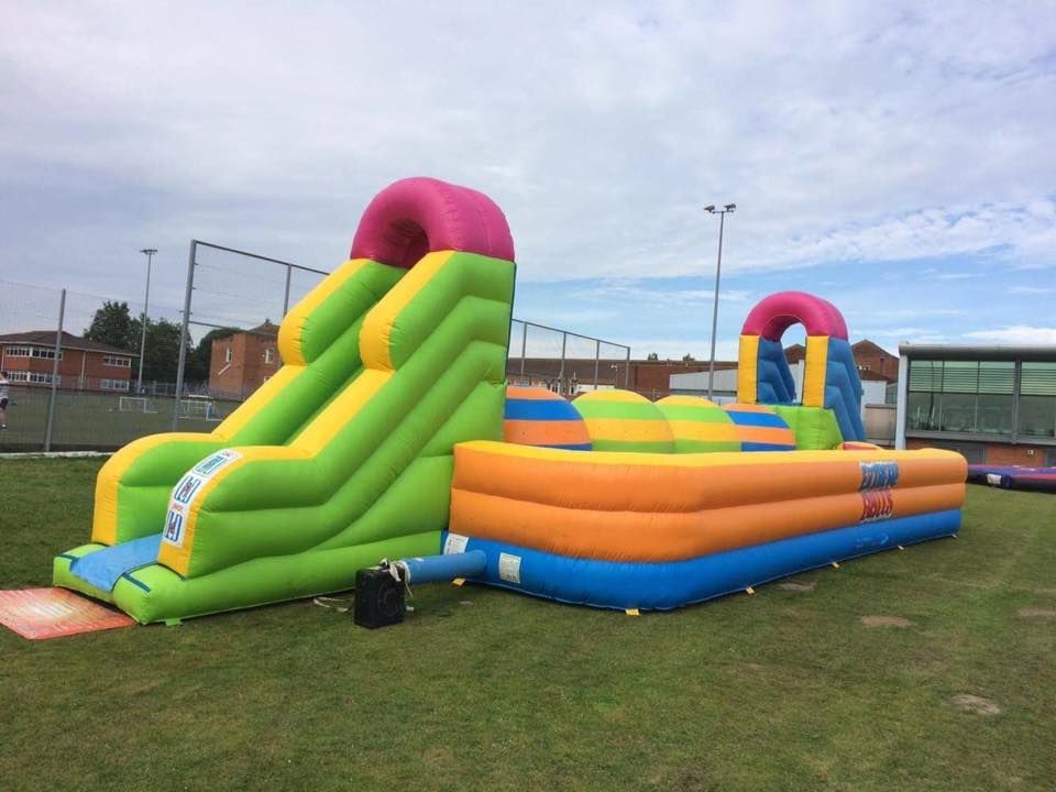 colourful big balls challenge inflatable in a field