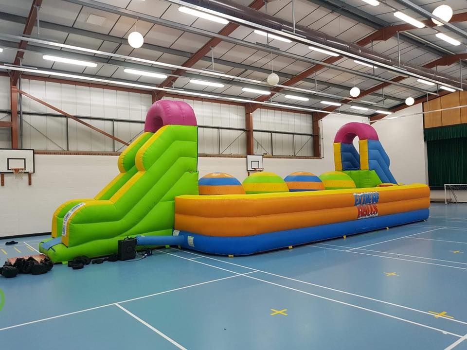 colourful big balls challenge inflatable in a field