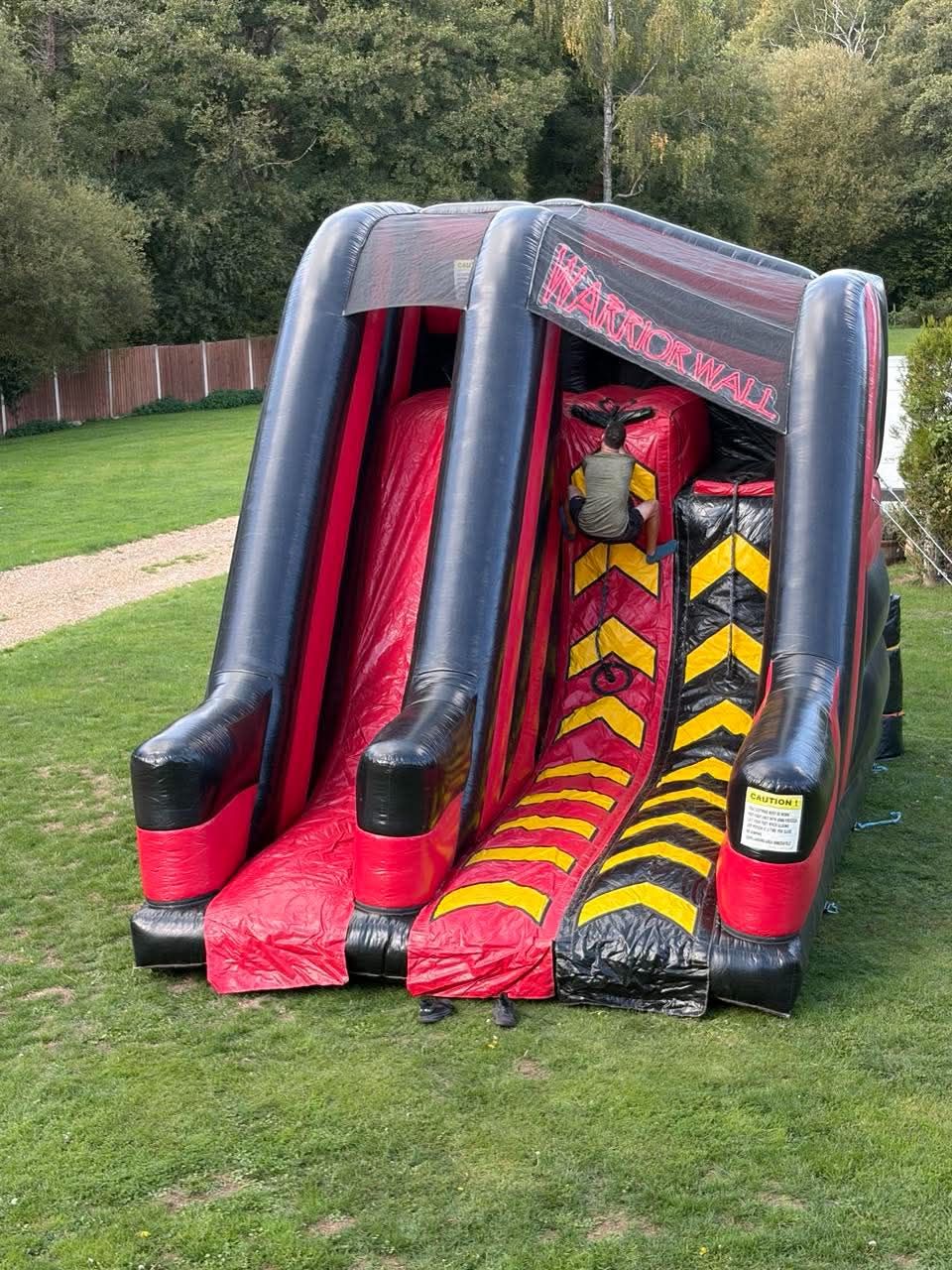 Rider sliding down the centre of the Warrior Wall after the climb