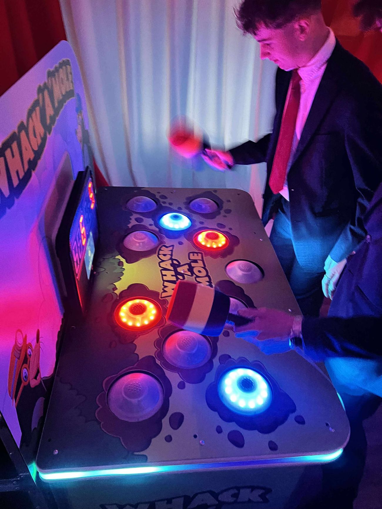 Whack A Mole game being played under event lighting
