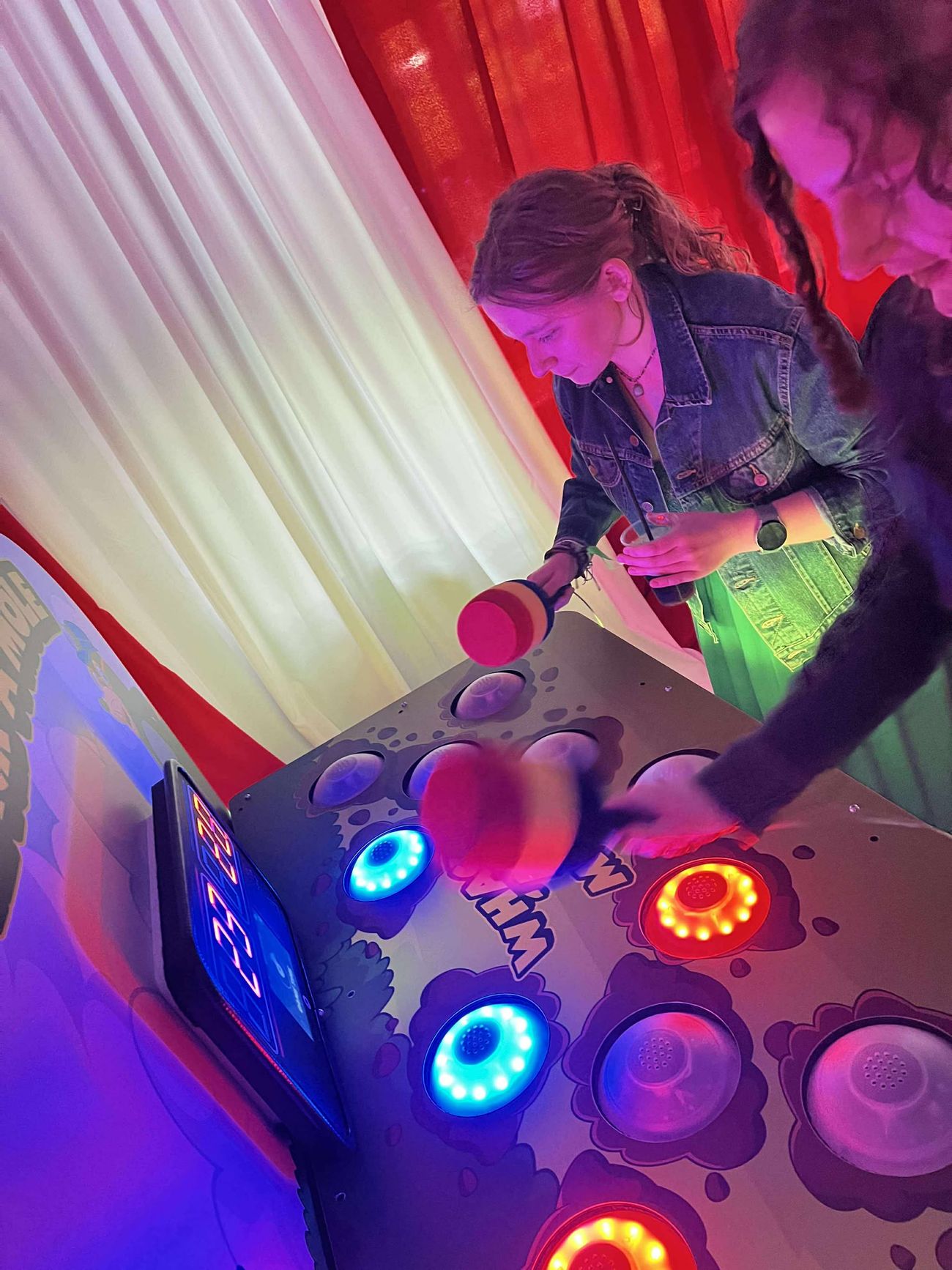 Close-up of Whack A Mole coloured targets lit up for gameplay