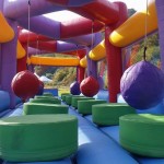 colourful inflatable ball run challenge with platforms to jump onto