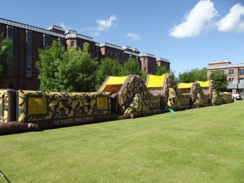 150ft army assault course inflated in front of trees