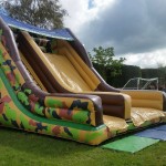 inflatable army slide in a football field