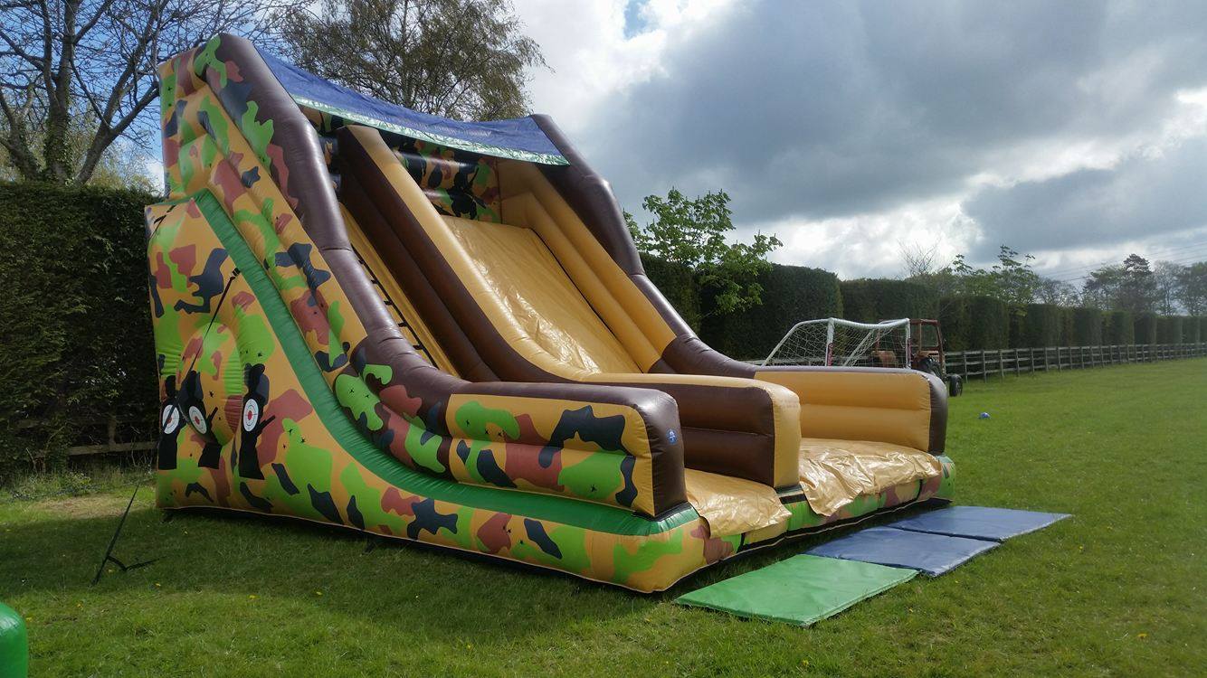 inflatable army slide in a football field Monster Event Hire