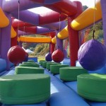 colourful inflatable ball run challenge with platforms to jump onto