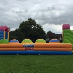 colourful big balls challenge inflatable in a field