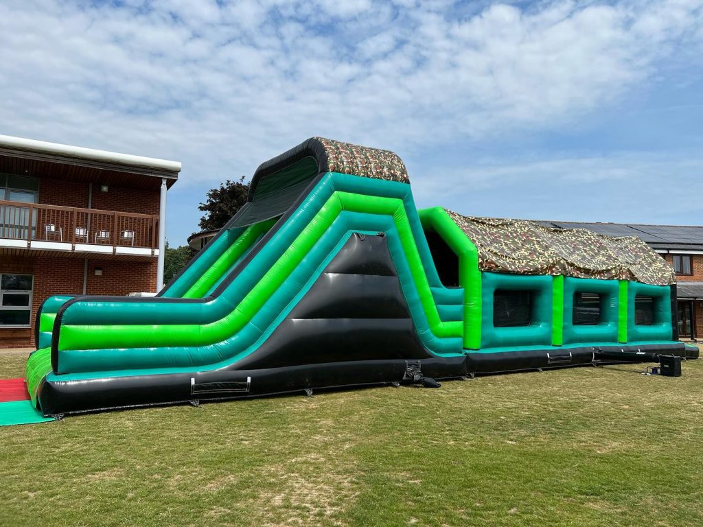 Green Giant 70ft assault course inflatable assault course hire